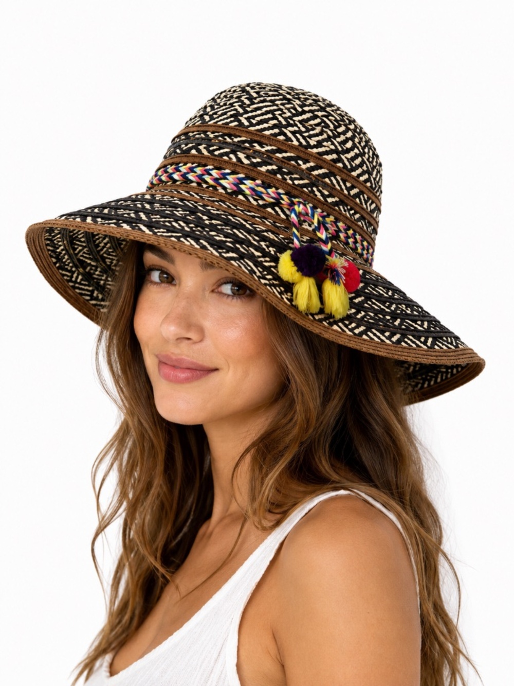 Steve Madden floppy, woven straw hat with tassels.